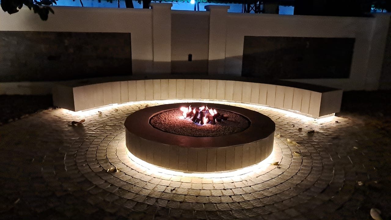 Circular fire lounge with ambient lighting